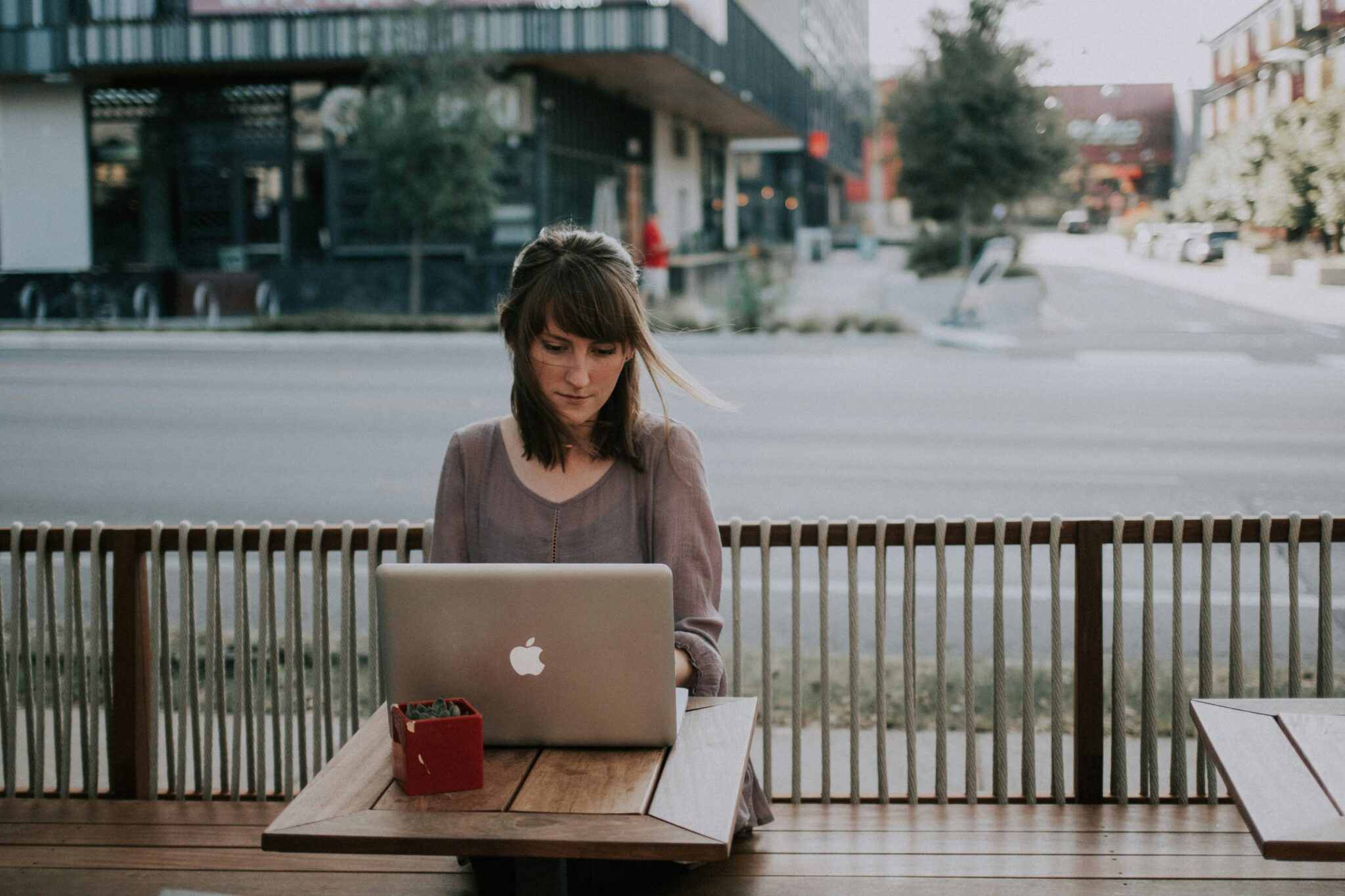 Woman working on her laptop in a terrace